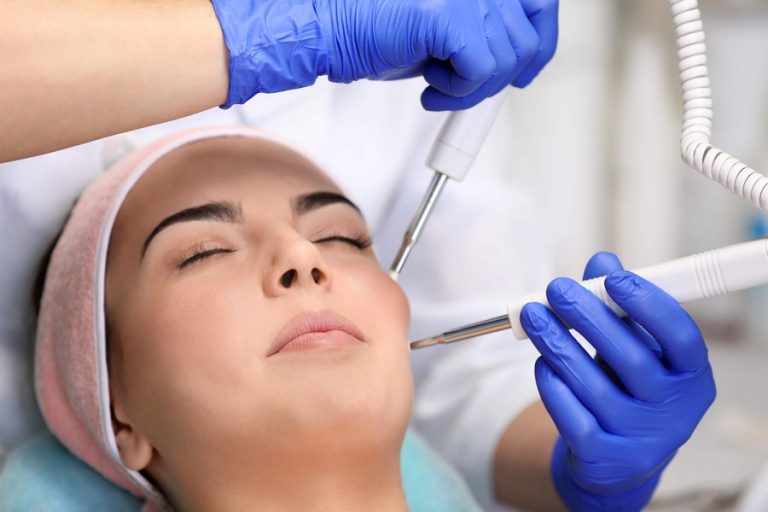 Young woman having face procedures in a beauty salon