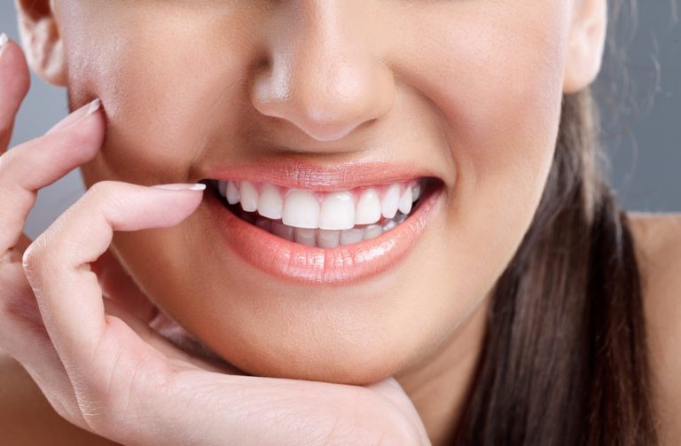 close up, beautiful  young woman with big healthy smile